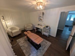 Chiropractic adjustment being performed at Dr. Jen O'Shea's home-based clinic in Burlington