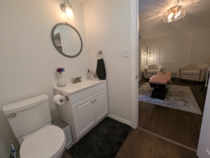 Chiropractic adjustment being performed at Dr. Jen O'Shea's home-based clinic in Burlington